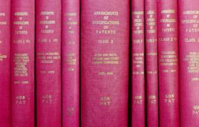 A row of red hardcover books titled 'Abridgments of Specifications of Patents'.