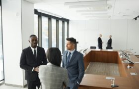 Business professionals engaging in a meeting in a modern conference room.